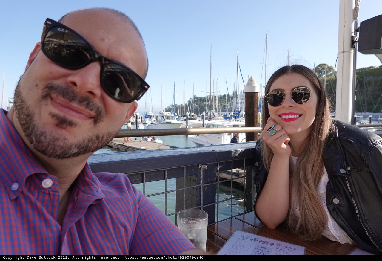 Couple Enjoying Waterfront Dining at Marina
