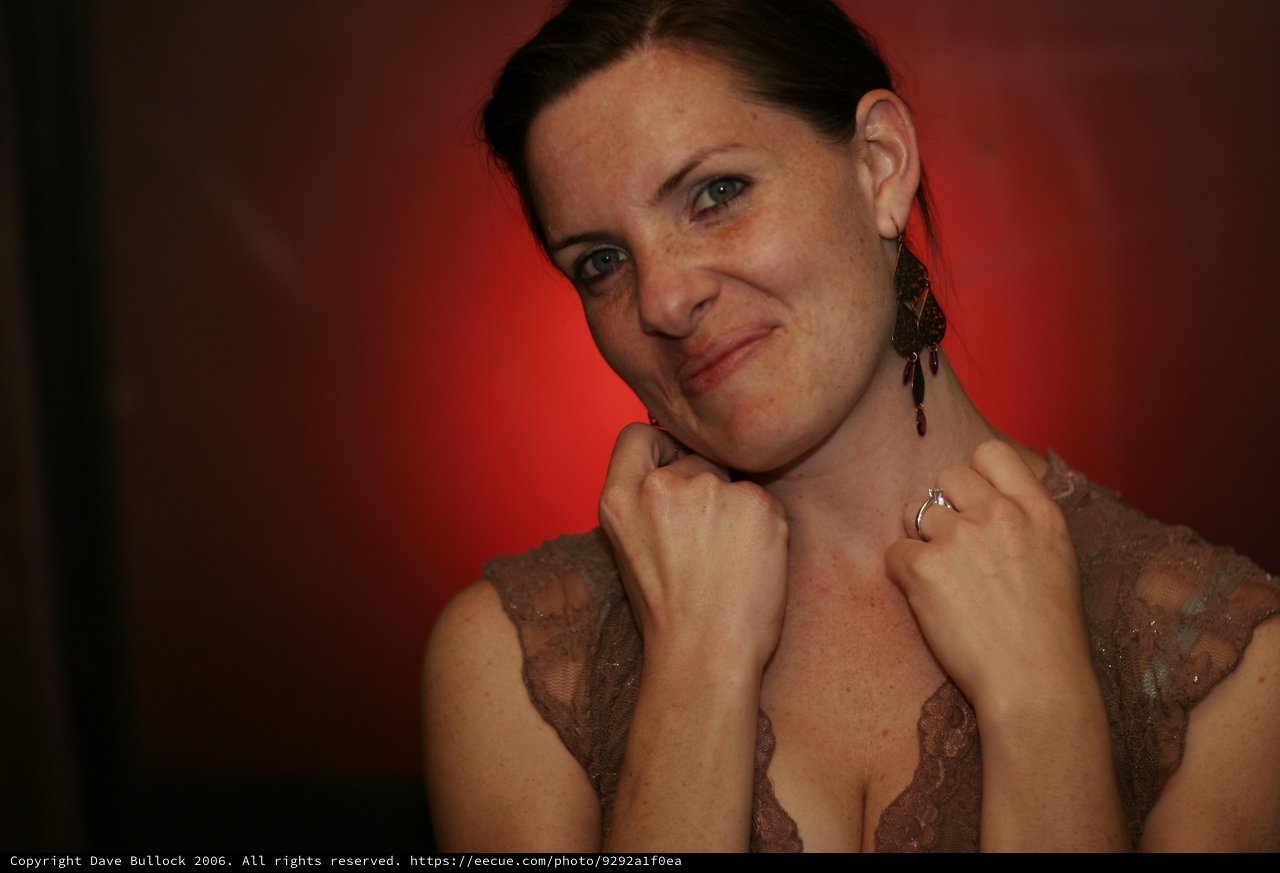 Playful Portrait of Penelope Against Red Background