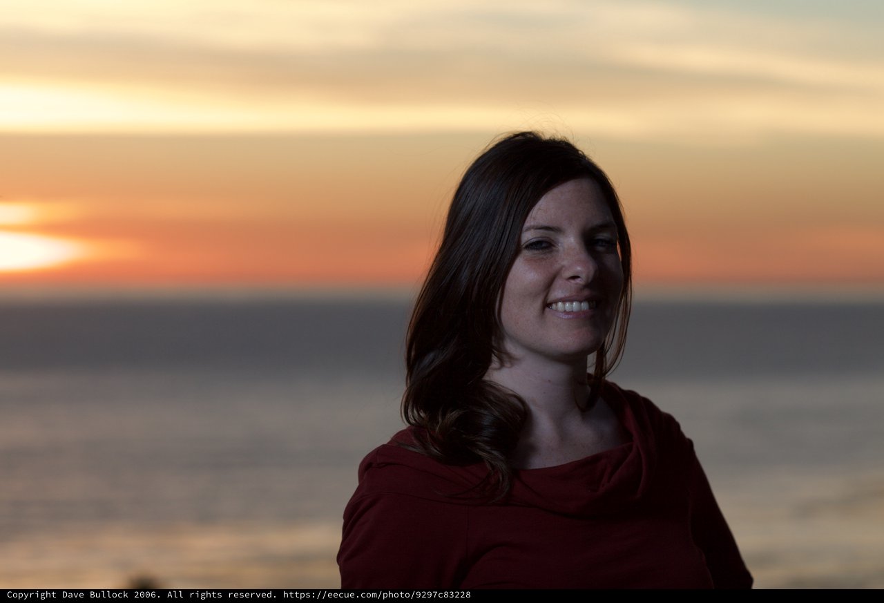Smiling Woman at Golden Ocean Sunset Portrait