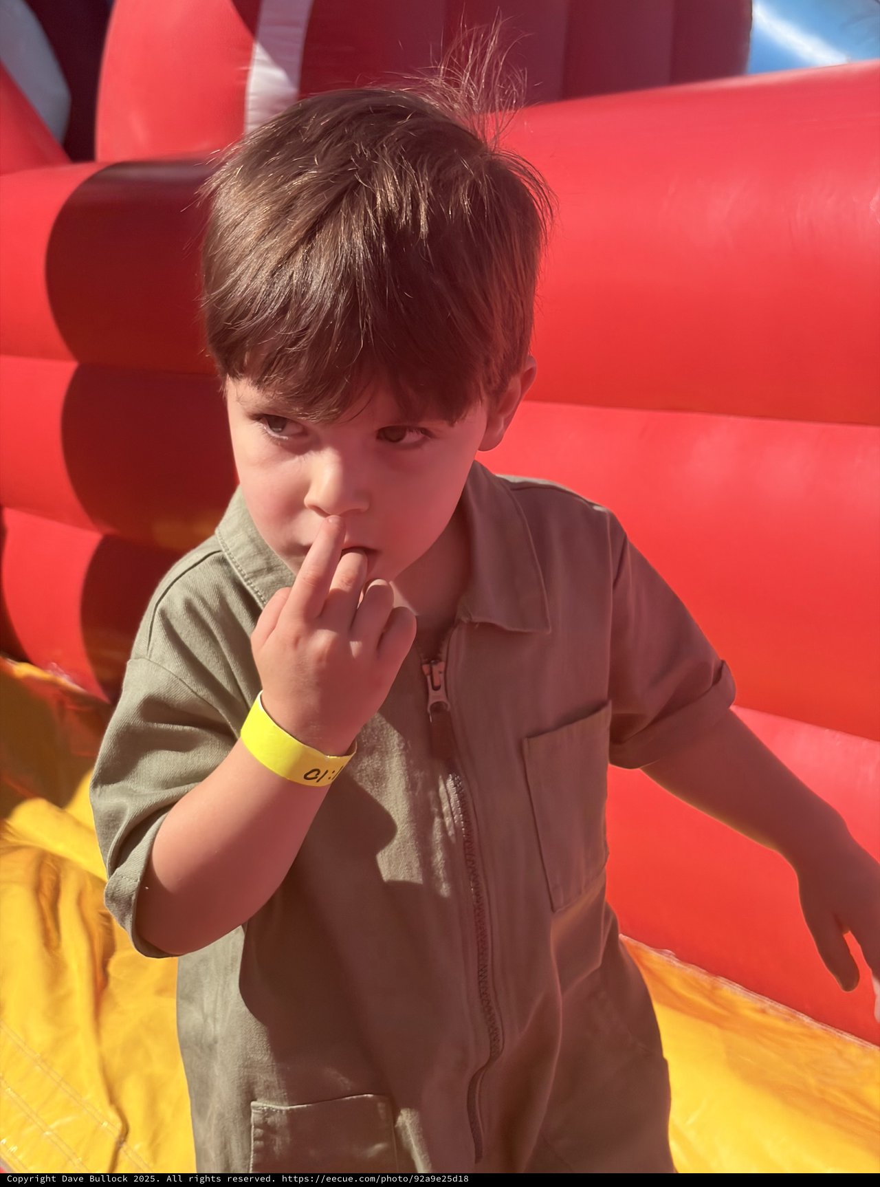 Young Boy Making Shh Gesture at Indoor Play Center