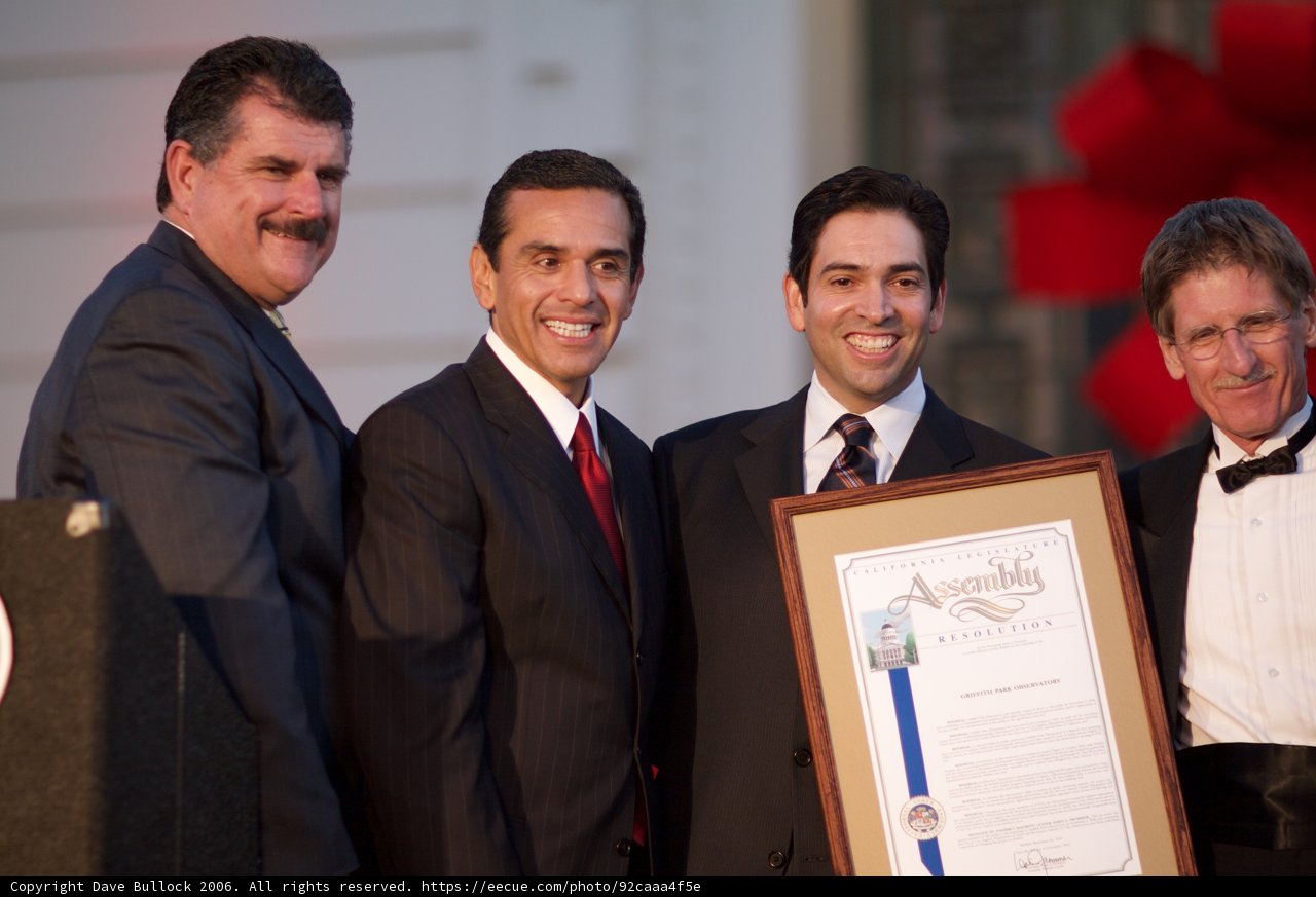 Four Men in Suits Receiving a Certificate