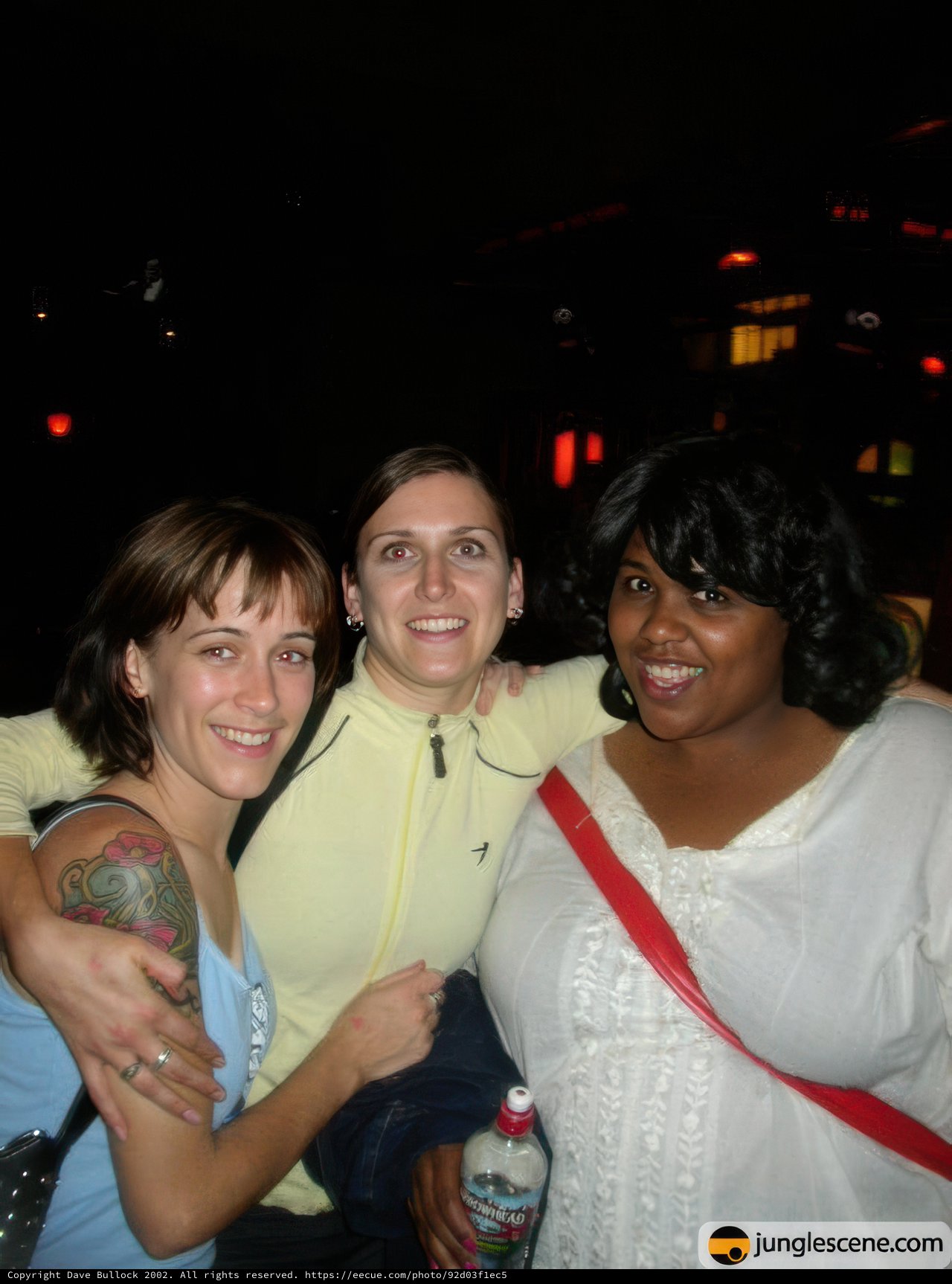 Three Tattooed Women Strike a Pose Outdoors