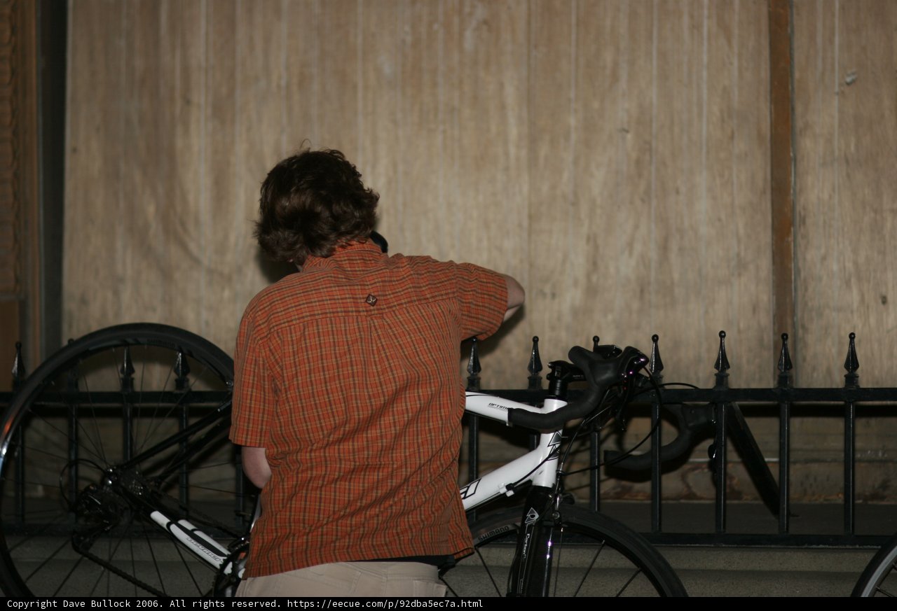 Man admires sleek bicycle during downtown art ride