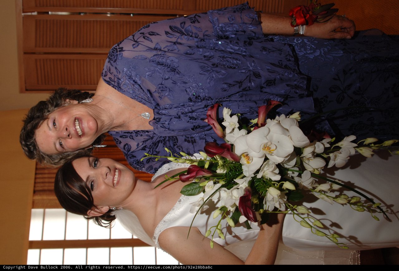 Bride and Mother Share Joyful Wedding Day Moment