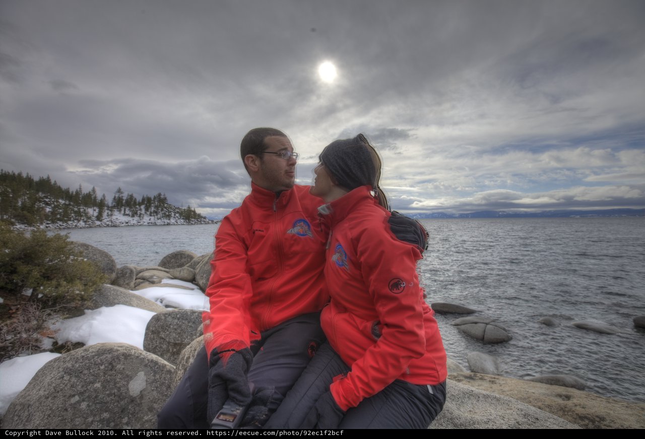 Couple's Intimate Moment by Winter Lake Tahoe Shore