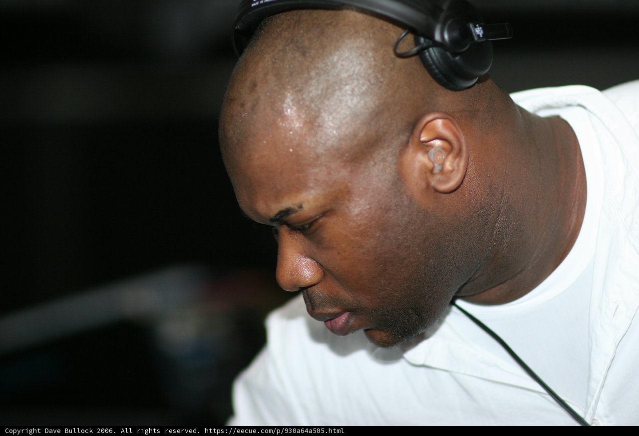 White Shirted Man Listening to Music