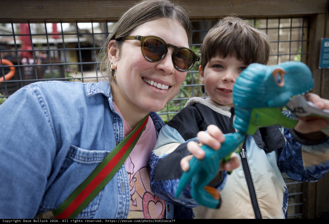 Mother and Son's Joyful Day with Dinosaur Toy