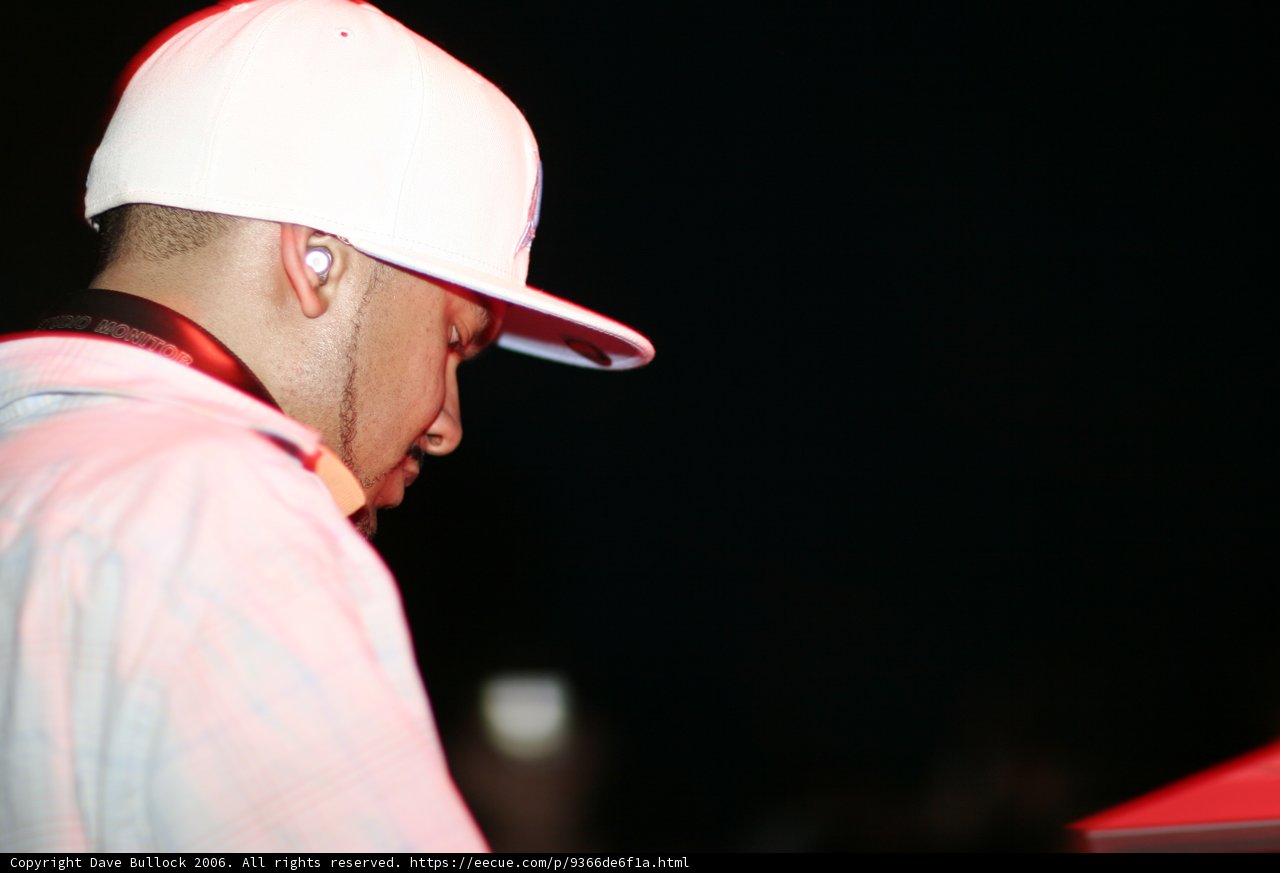 Man in Hat and White Shirt