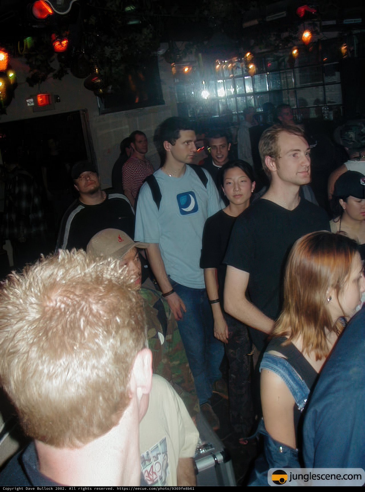 Nightclub Crowd in Hats and Jeans