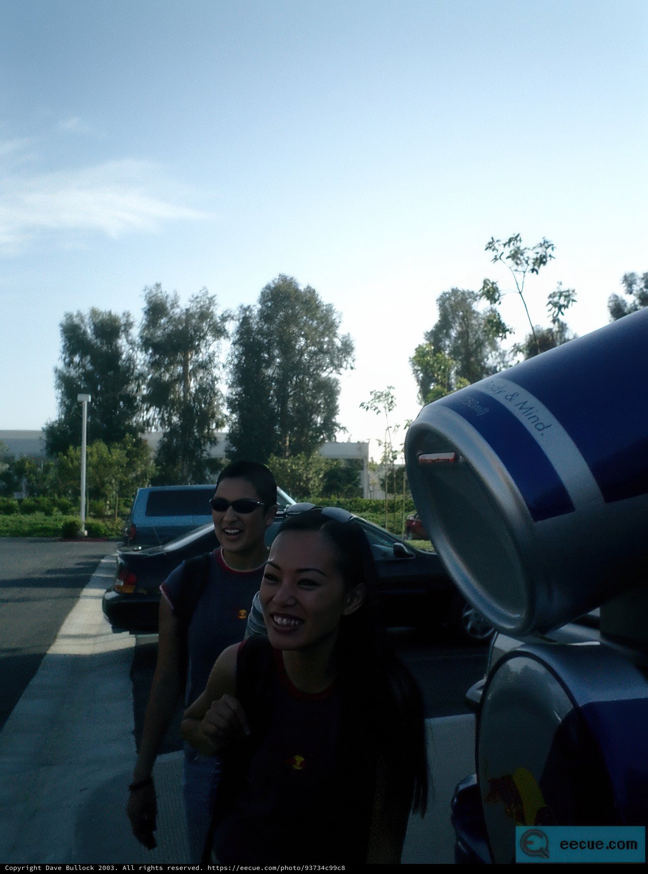 Standing Proud Next to a Red Bull