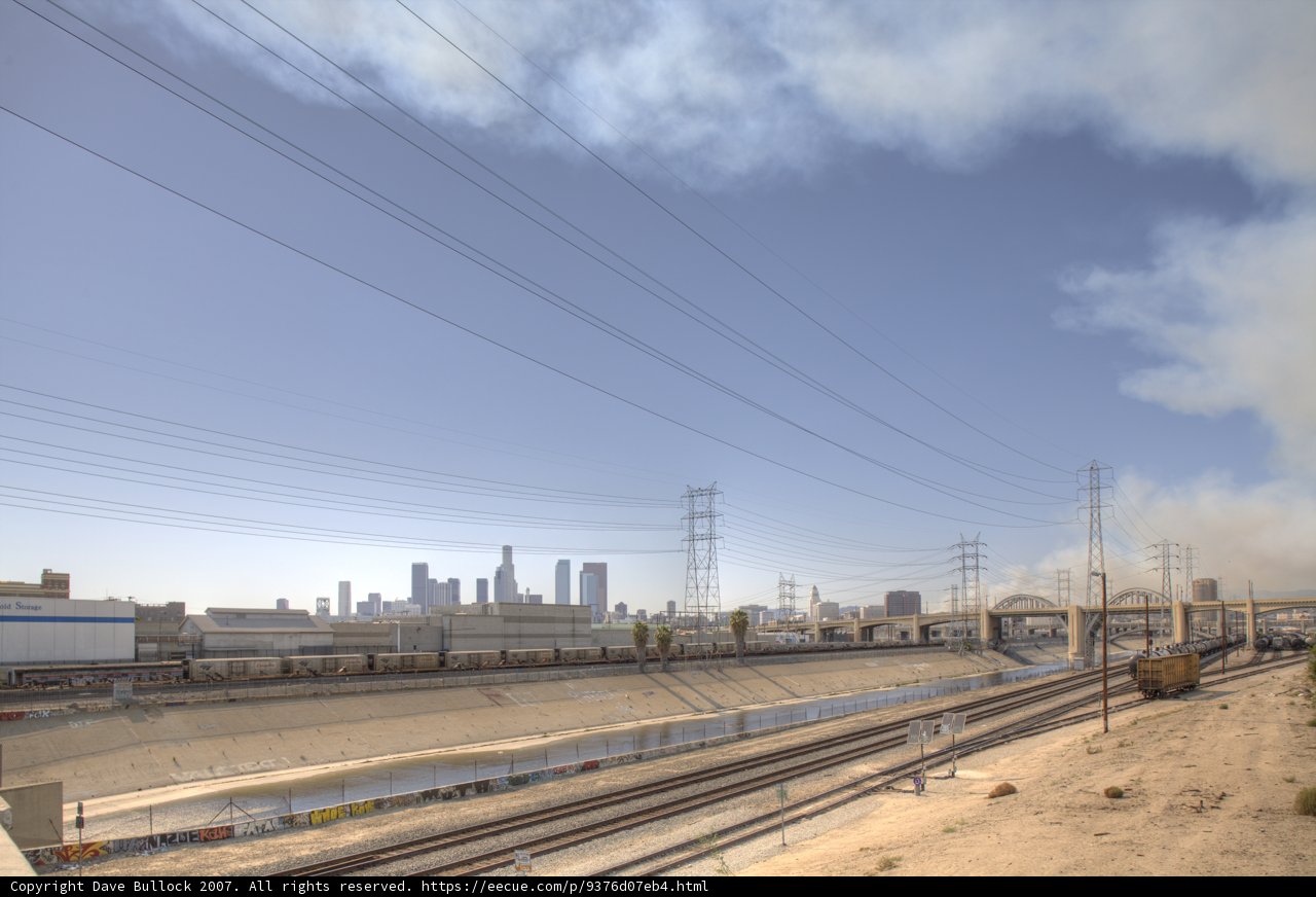 Smoke and Steam: Train Passing Through City