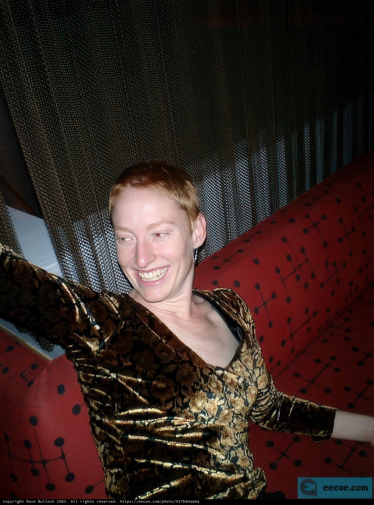 Redheaded Woman Relaxing on Velvet Couch