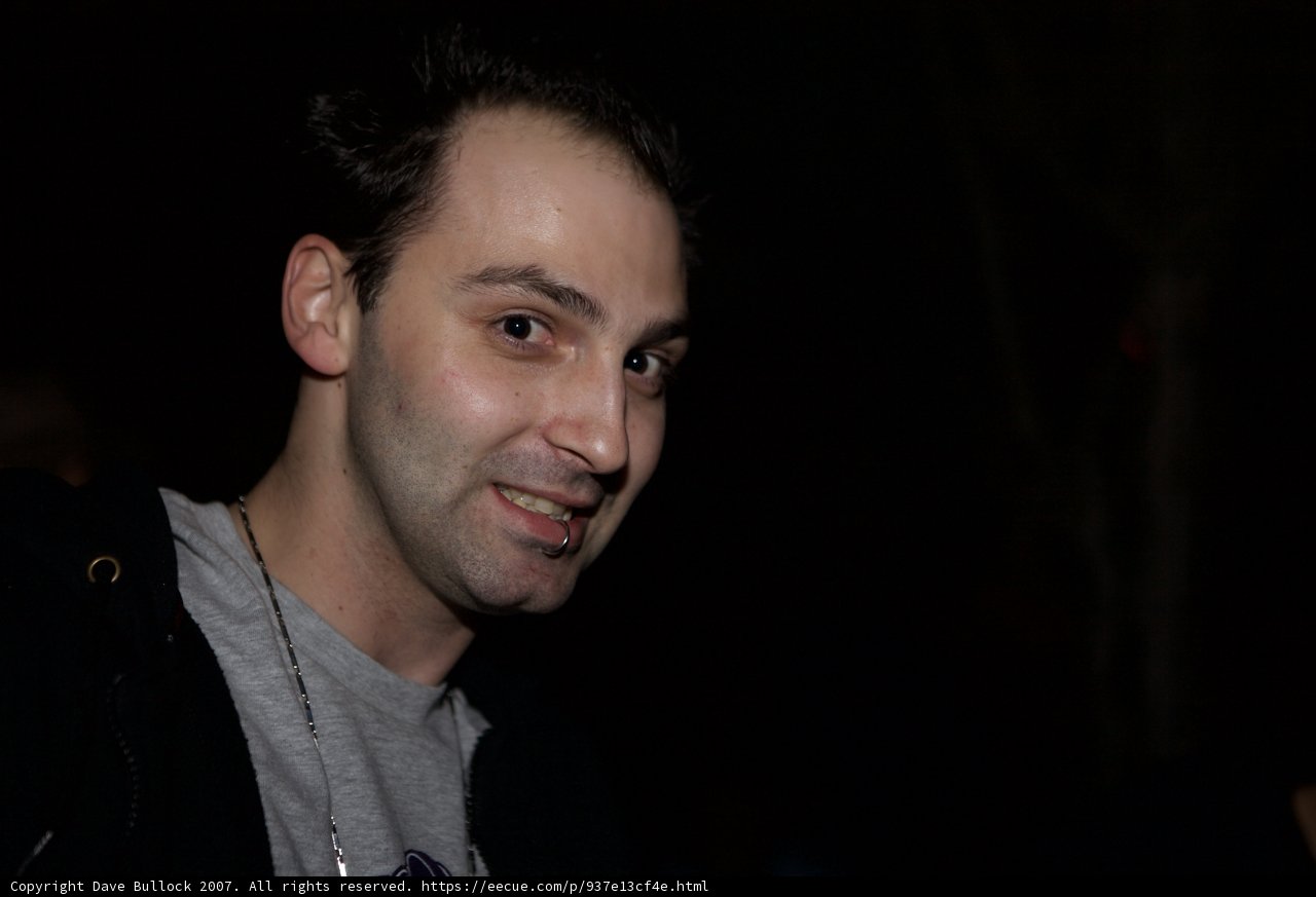 Smiling Man in Black Jacket