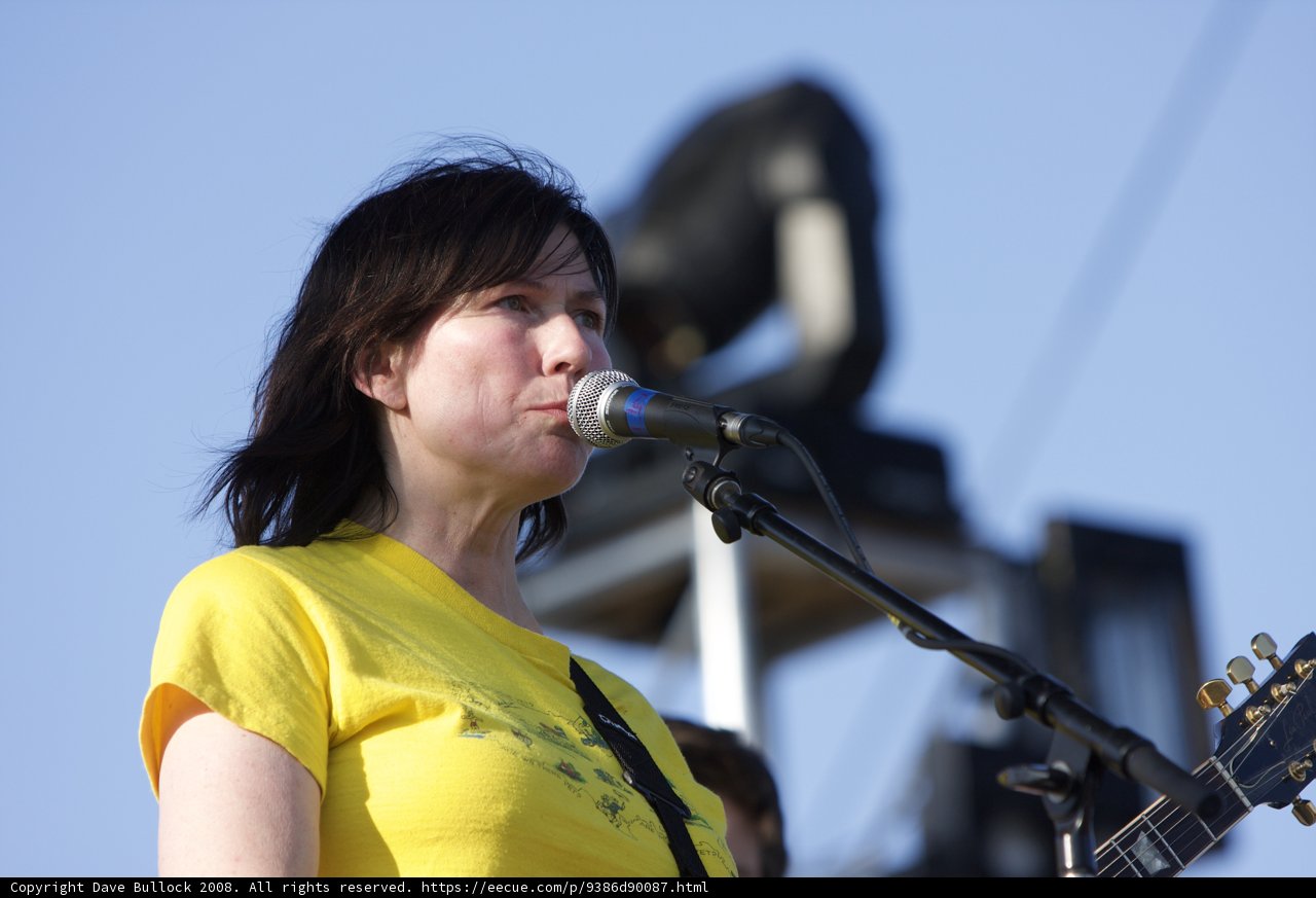 A Yellow Shirted Kelley Deal Plays the Acoustic Guitar