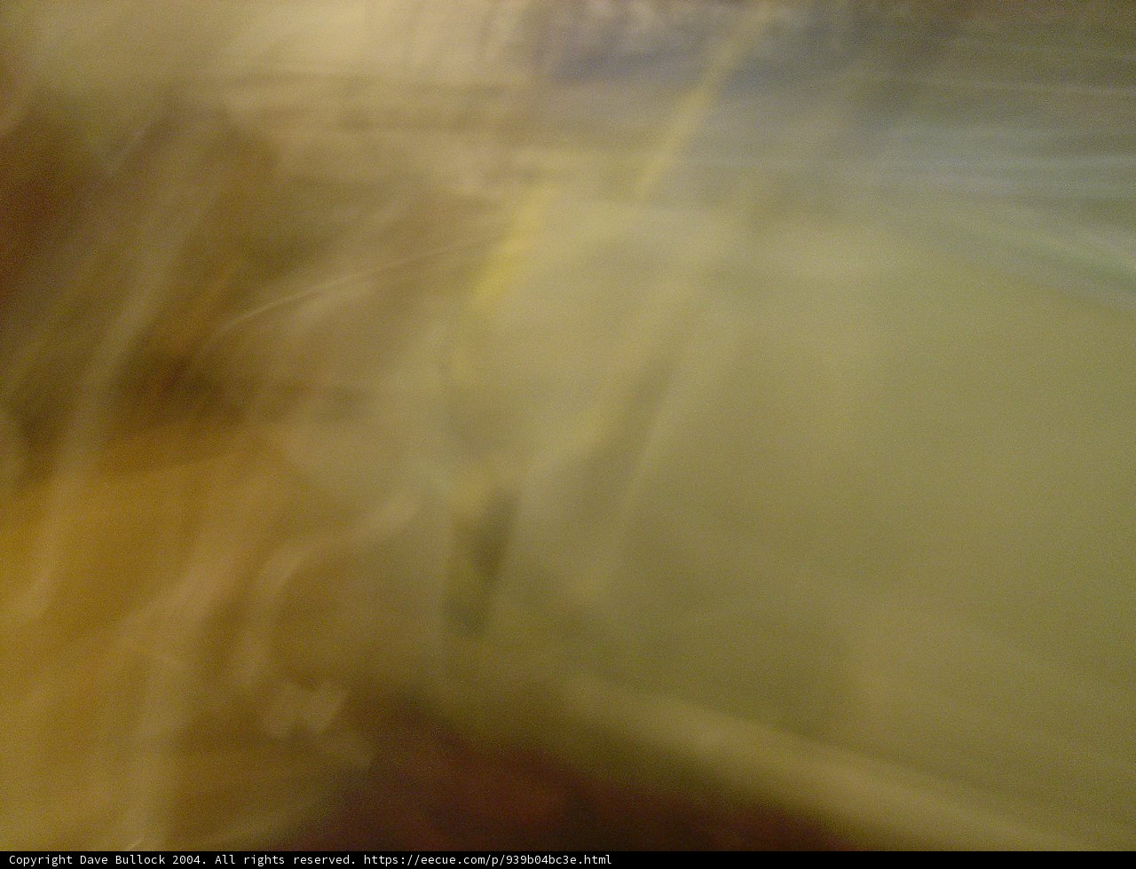 Blurry figure in wooden surroundings