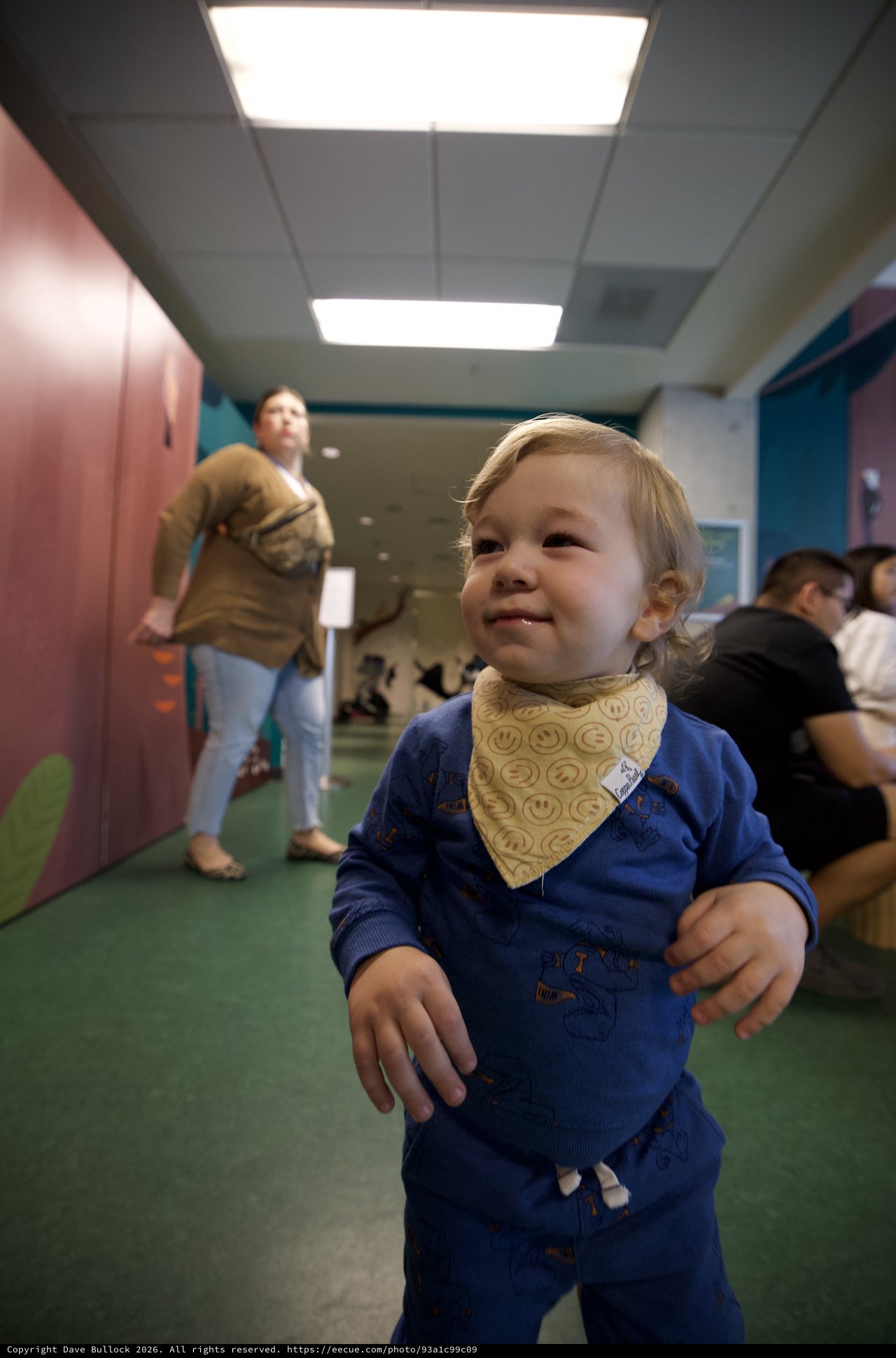 Joyful Toddler in Blue at Daycare Center