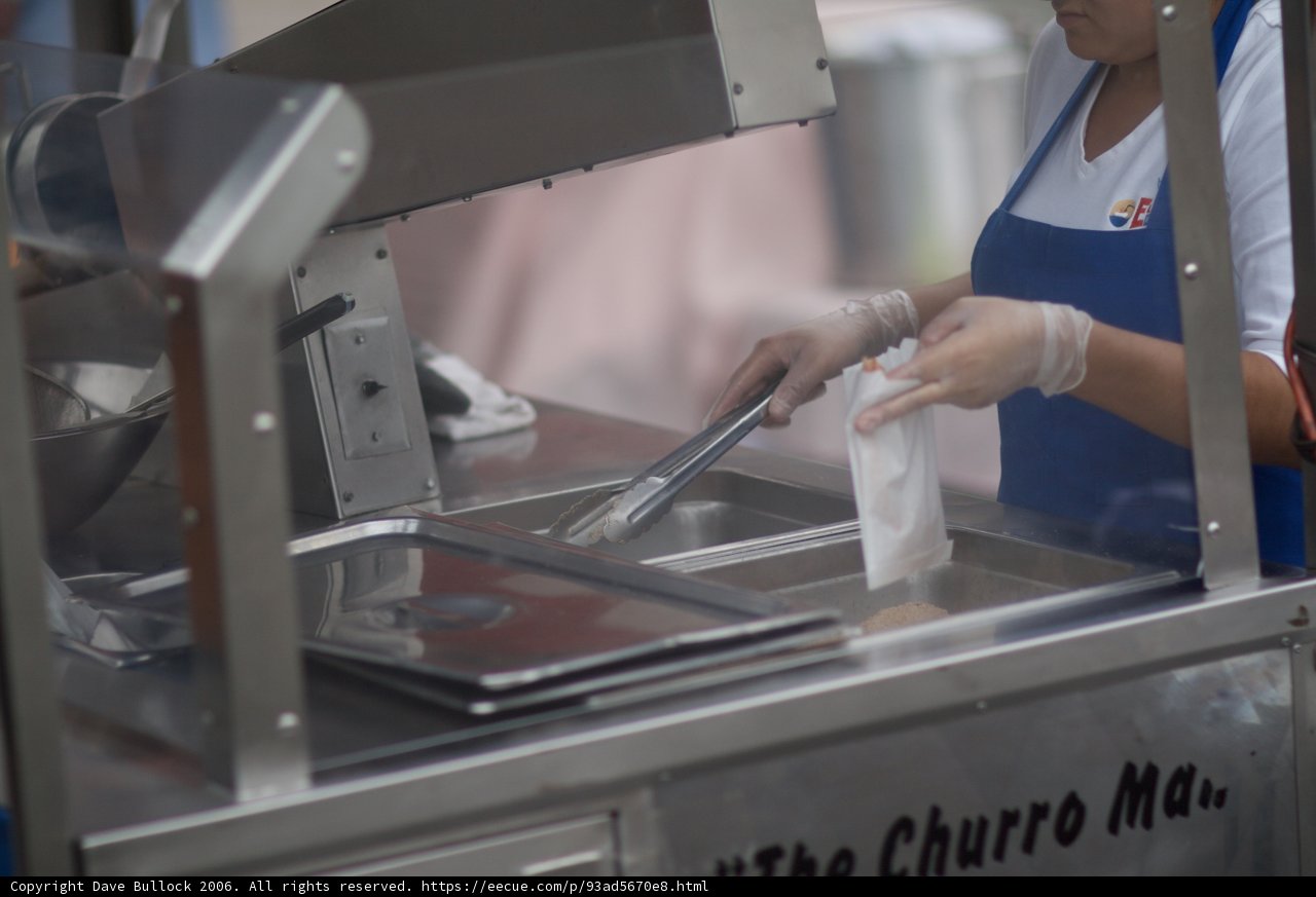 Factory Worker Wears Gloves While Making Sweet Treats