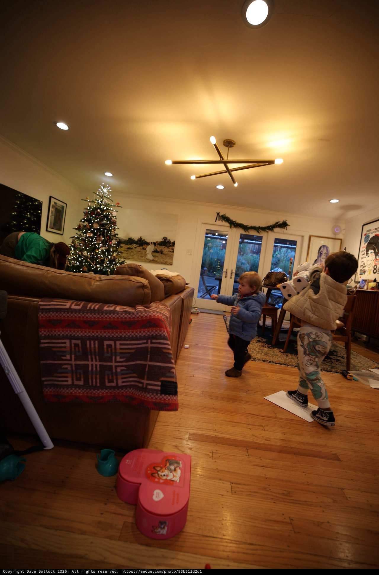 Children Playing in Cozy Living Room on Christmas Evening