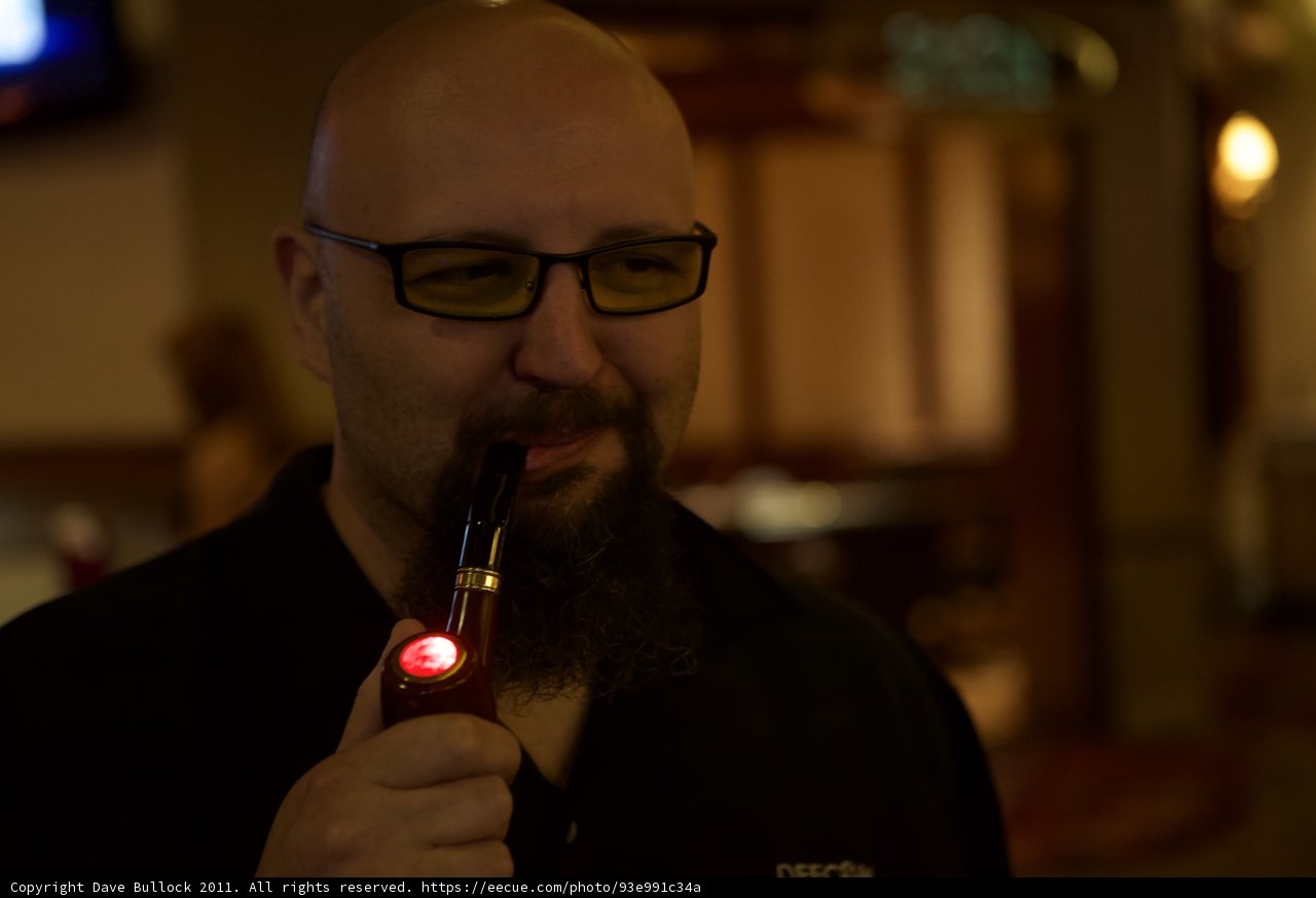 Bearded Gentleman Enjoying a Smoke and a Drink