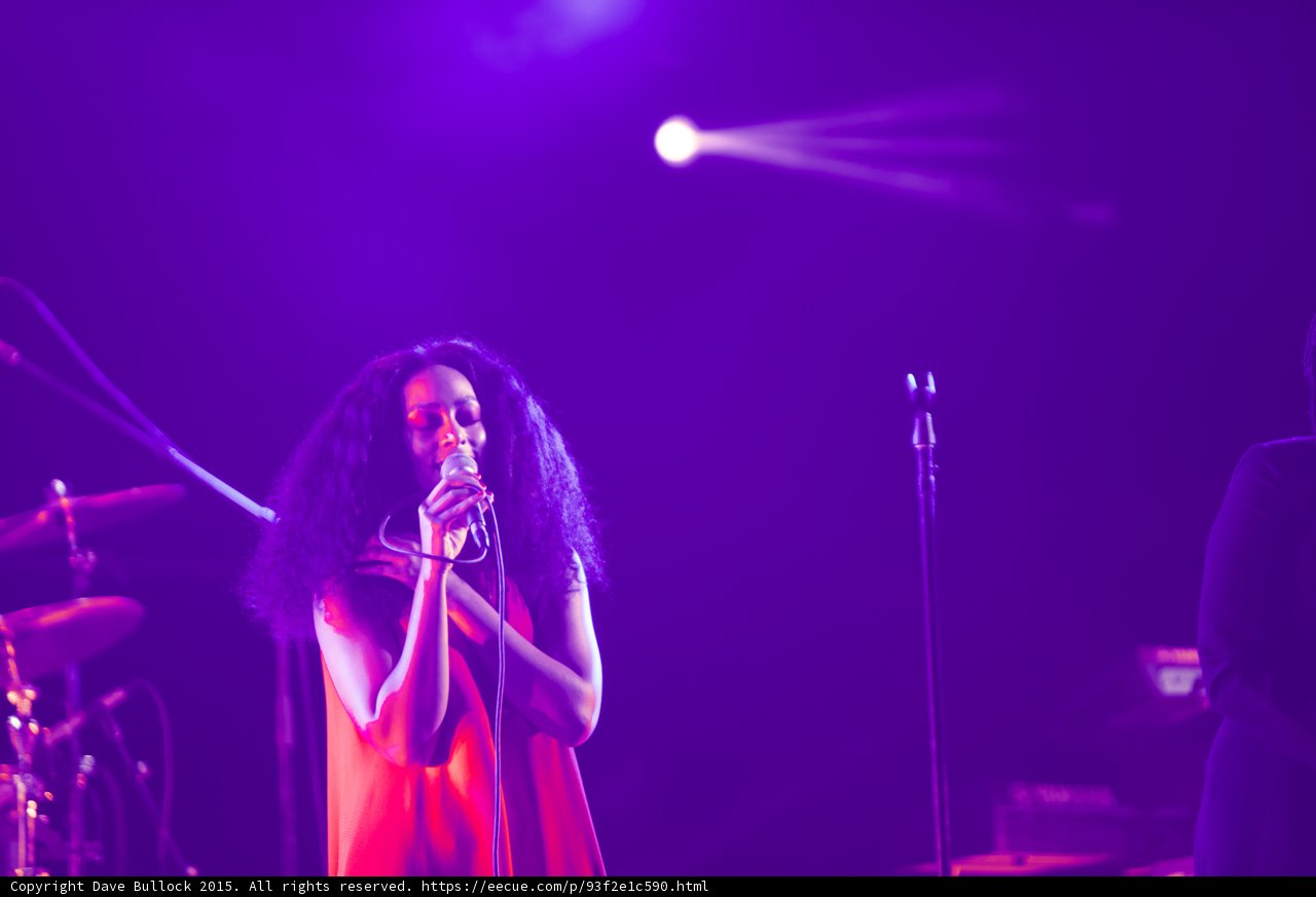Solange Portrait Red Dress Curly Hair Drum Kit Spotlight Purple