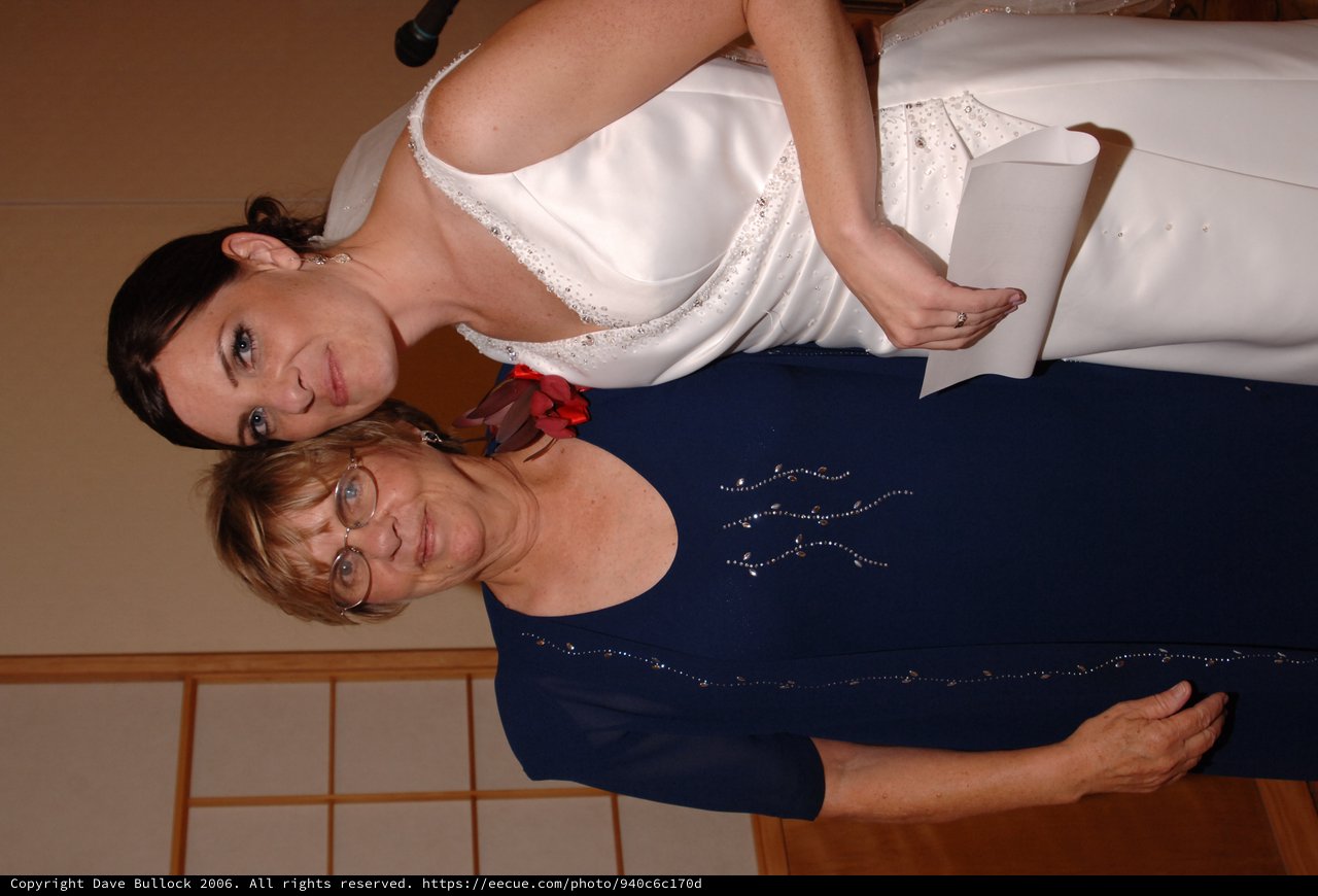 Bride and Loved One Share a Joyful Wedding Day Moment