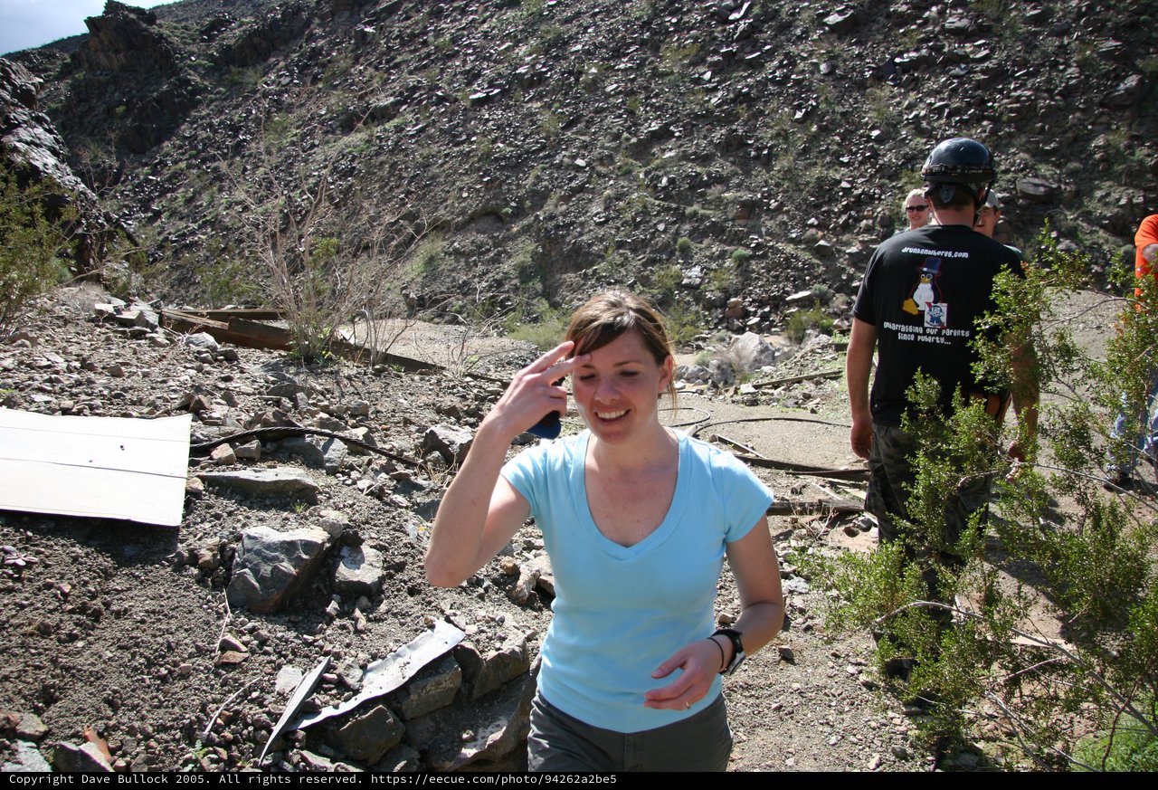 Woman Smiling at Rocky Desert Mine Site