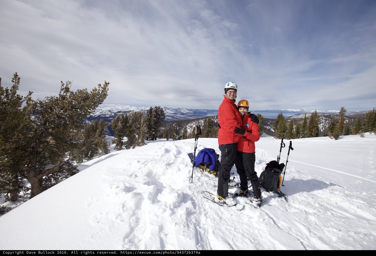 Couple Embracing at Snowy Lake Tahoe Summit