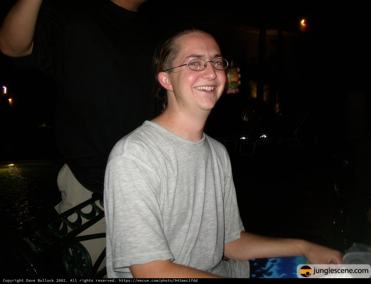 Smiling Man in Glasses