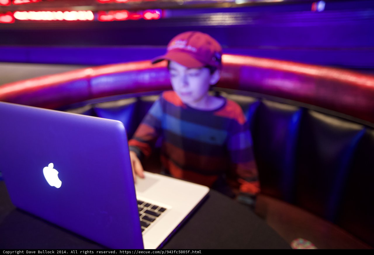 Young Boy Working Hard on His Laptop
