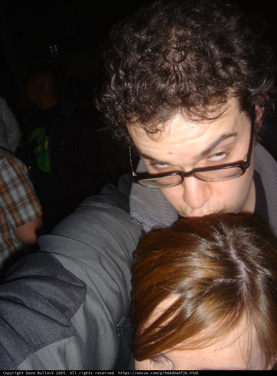 Curly-Haired Man at the Club