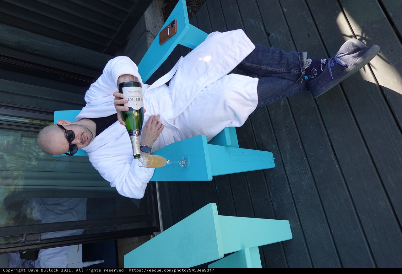 Relaxing with Champagne in White Robe