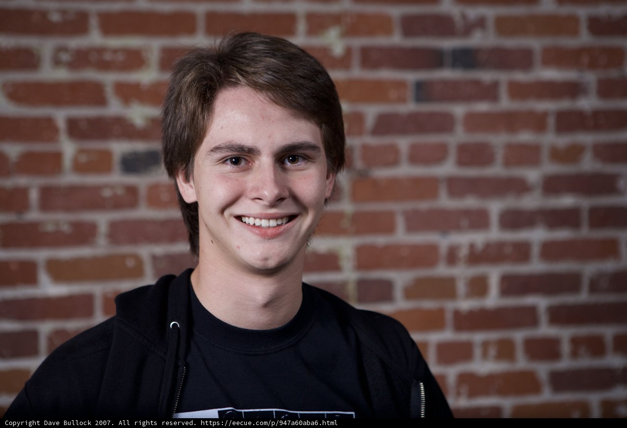 Happy Smiles in Front of Brick Wall