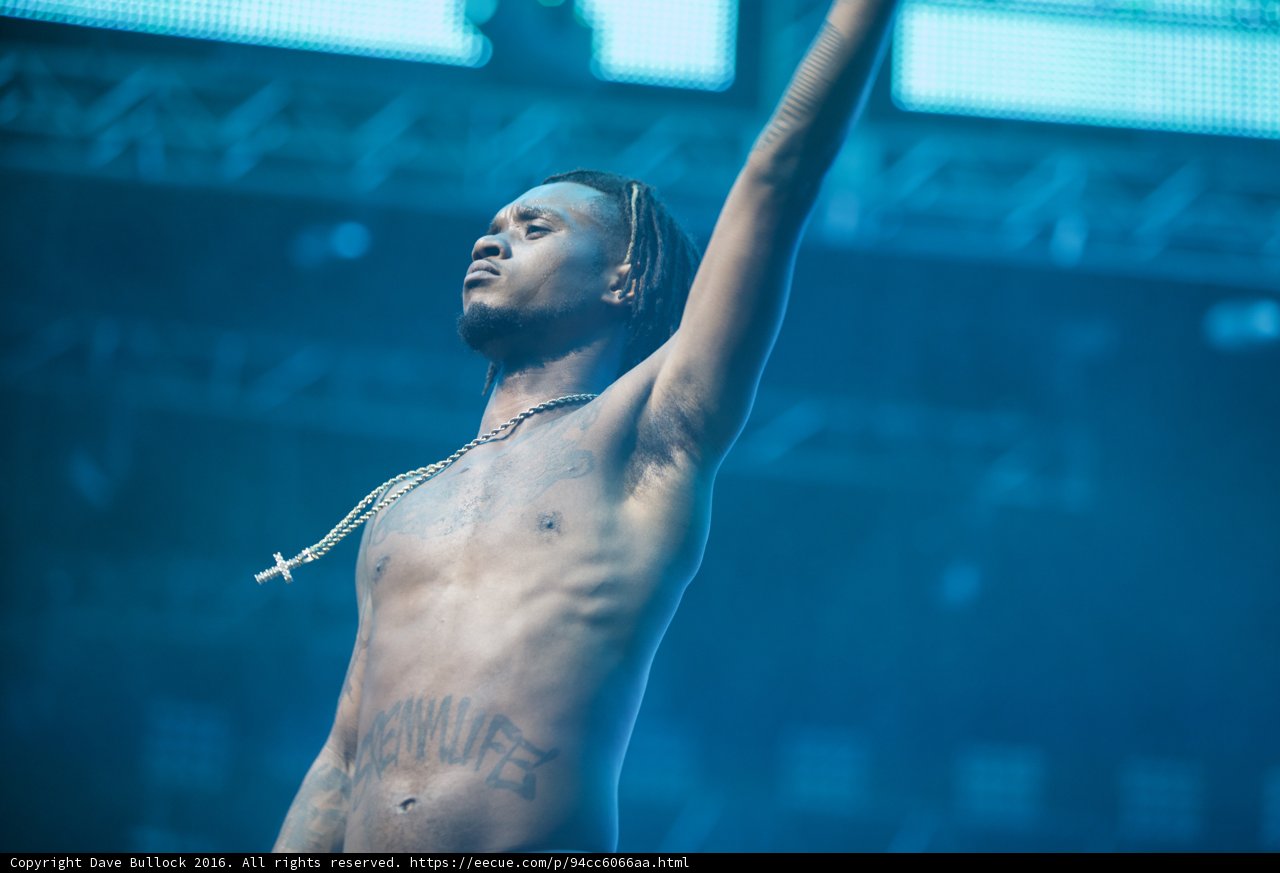 Shirtless Man Reaches for the Sky