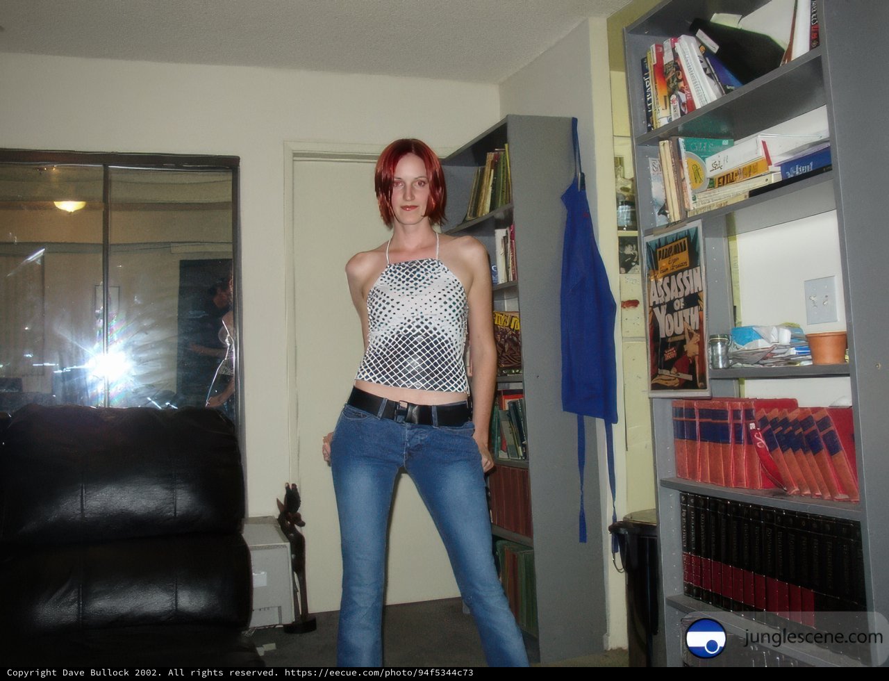 Woman standing in front of bookcase