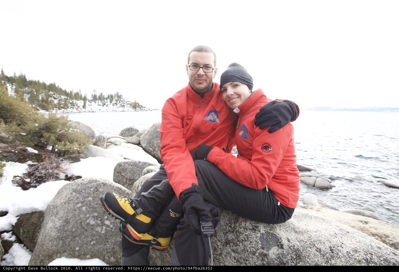 Couple Embracing on Snowy Lake Tahoe Shoreline