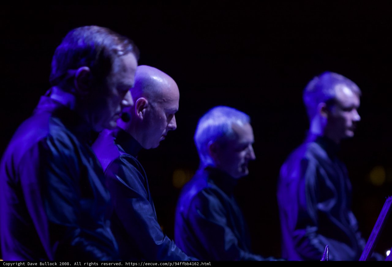 Men in Black Shirts Performing on Stage