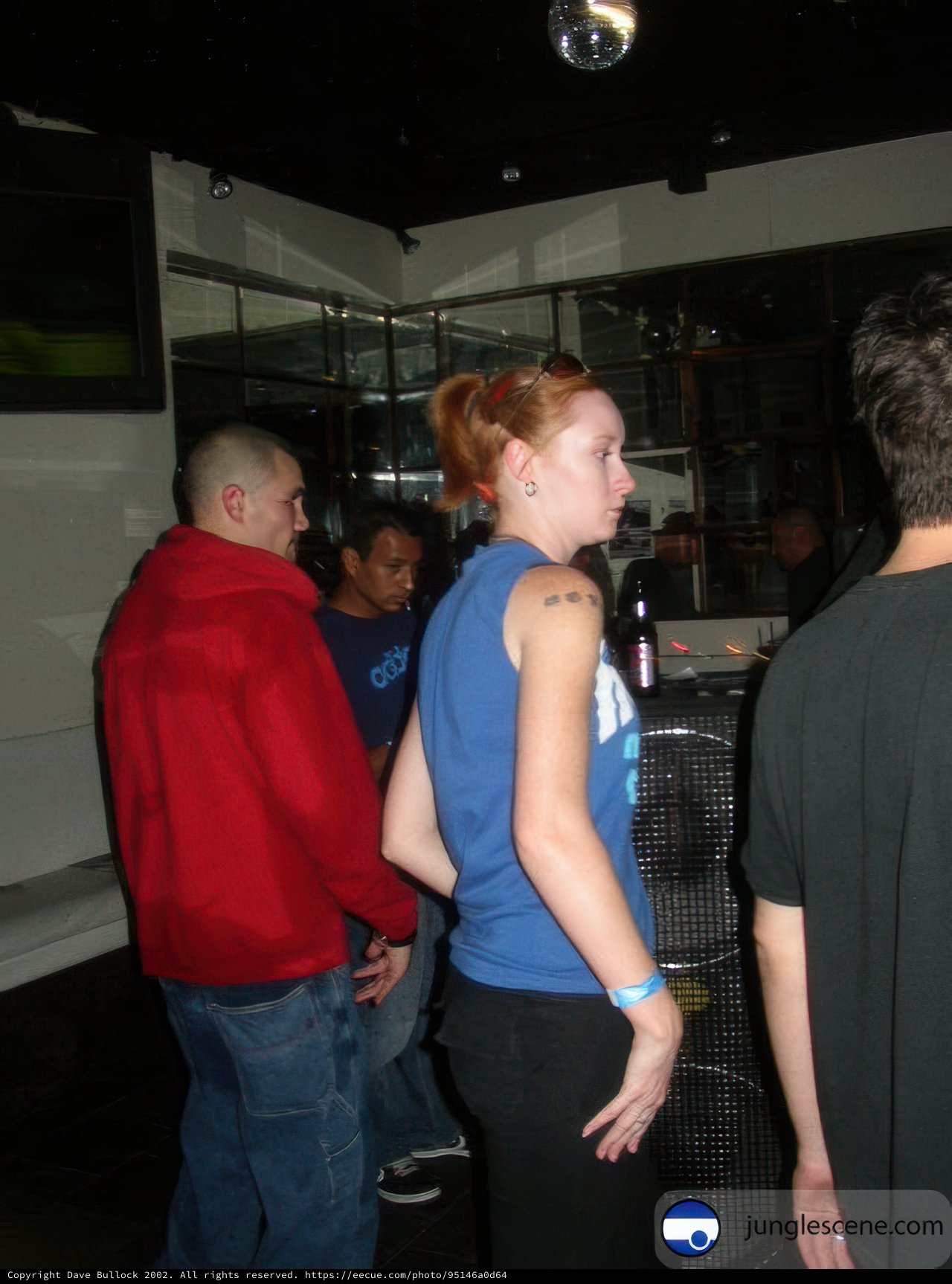 Nightclub enthusiasts watch the game on TV
