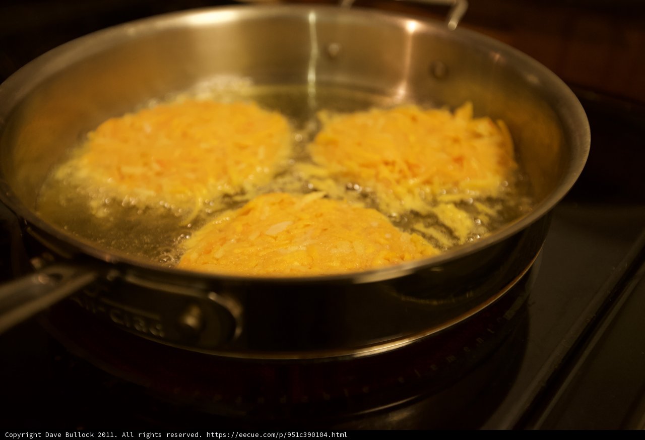 Trio of Eggs Sizzling on the Stove