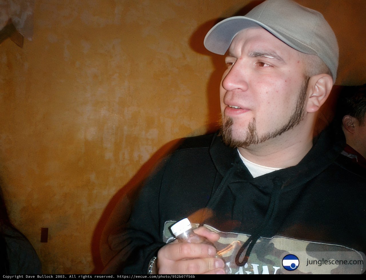 Man in Black Hoodie and White Hat