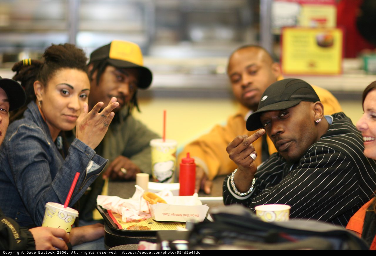 Friends Posing Together at a Fast Food Restaurant