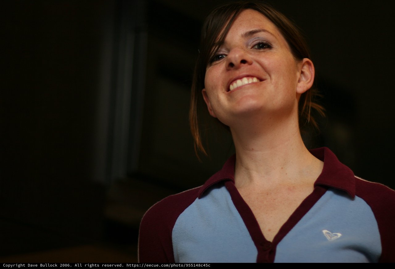 Joyful Woman Smiling Upward in Warm Light