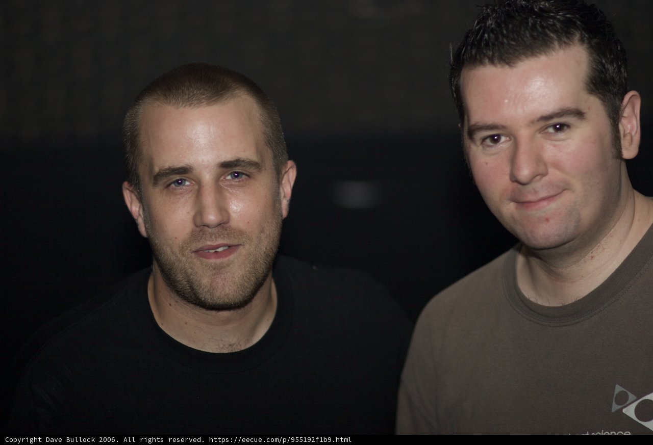 Two Men in a Dark Room