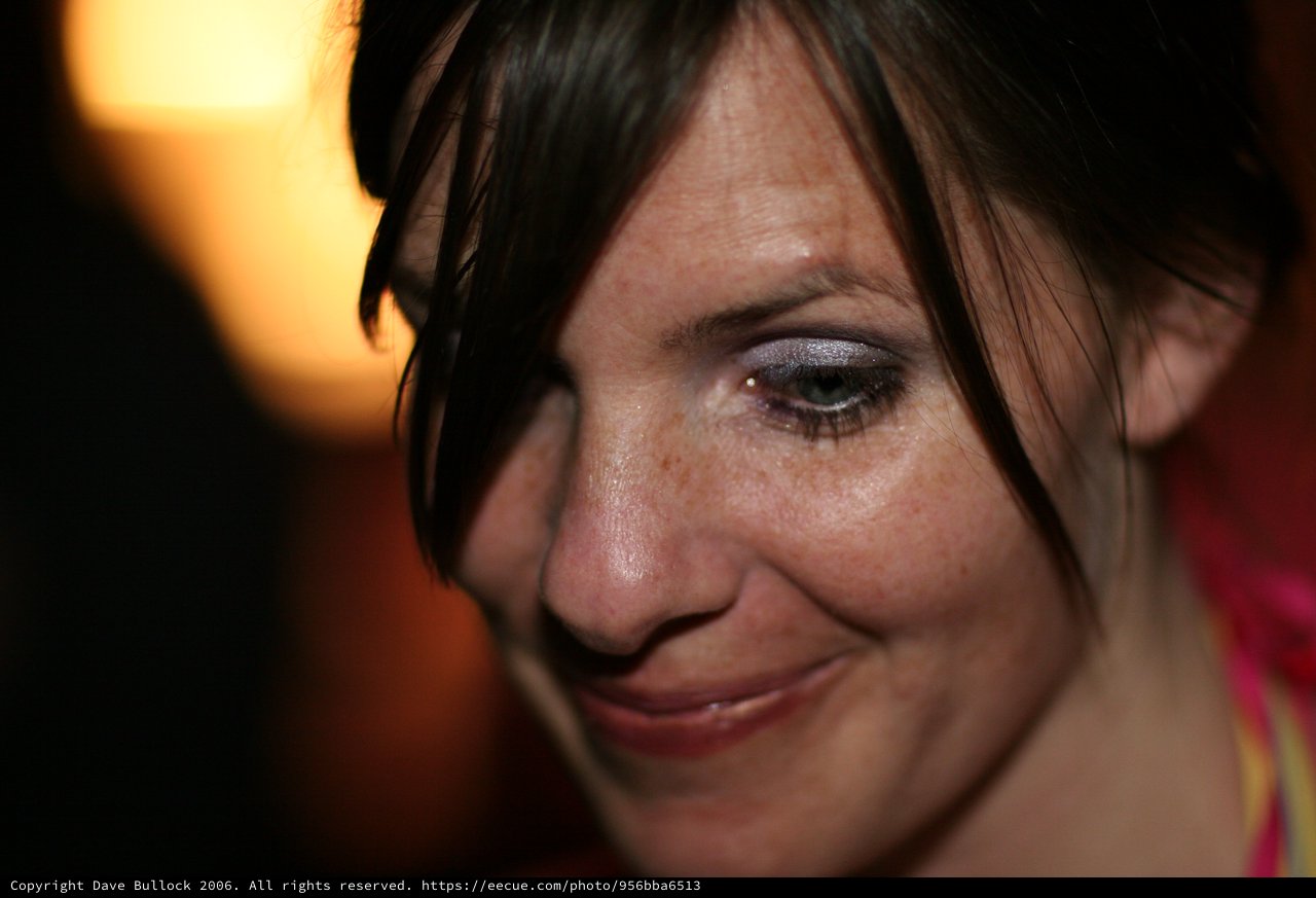 Intimate Close-Up Portrait of Smiling Woman with Dark Hair