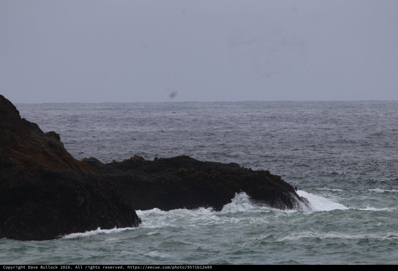 Rough Seas Breaking Against Dark Coastal Rocks
