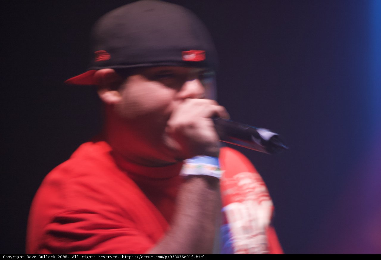 Red Shirted Entertainer with Microphone and Baseball Cap