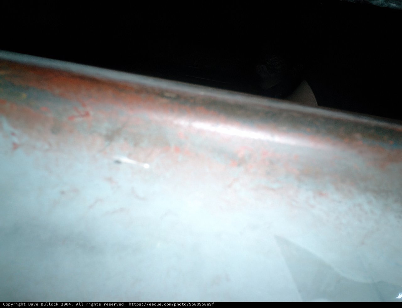 Rust and Corrosion on a White Surface