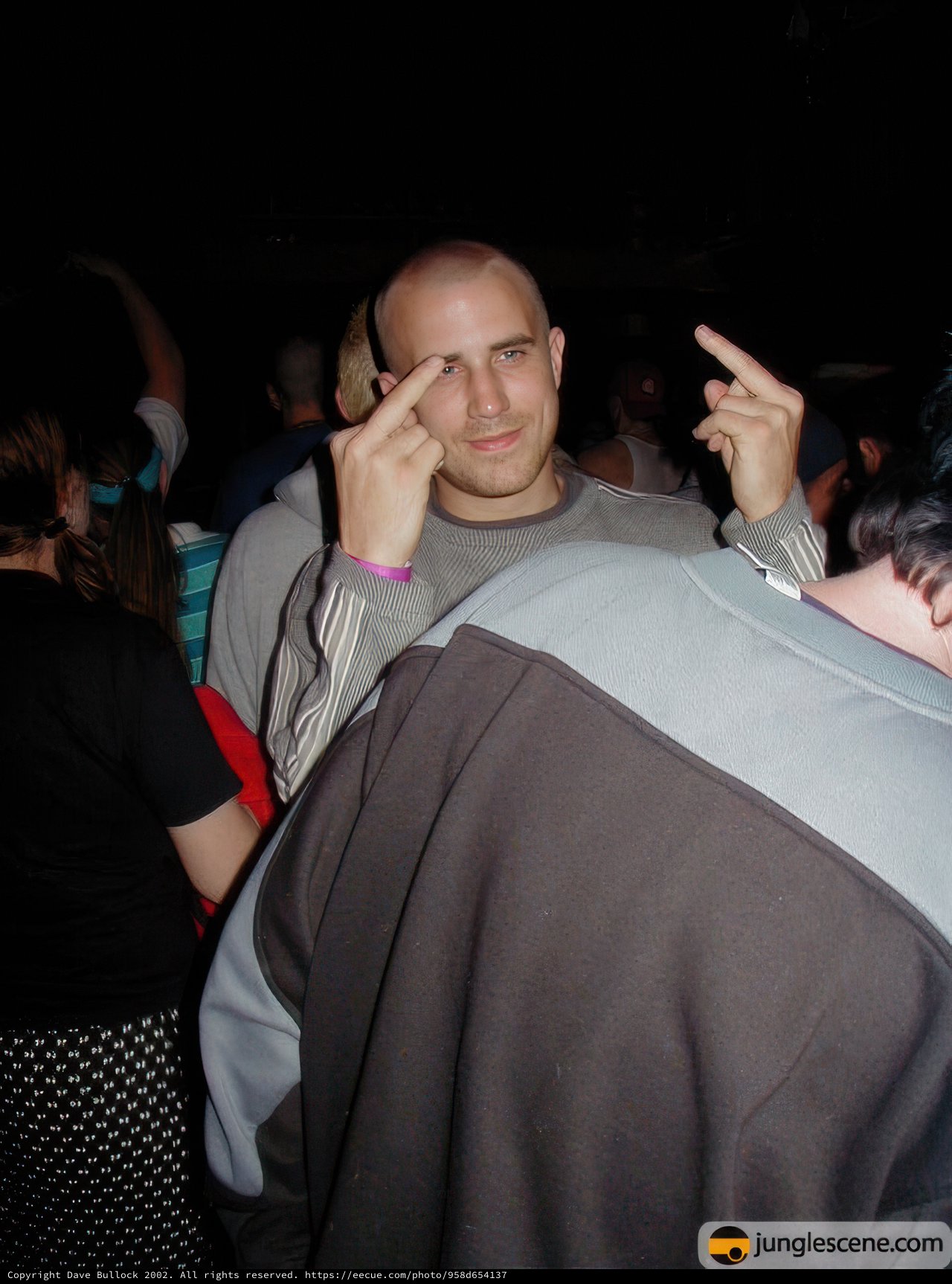 Partygoer with Upraised Hands