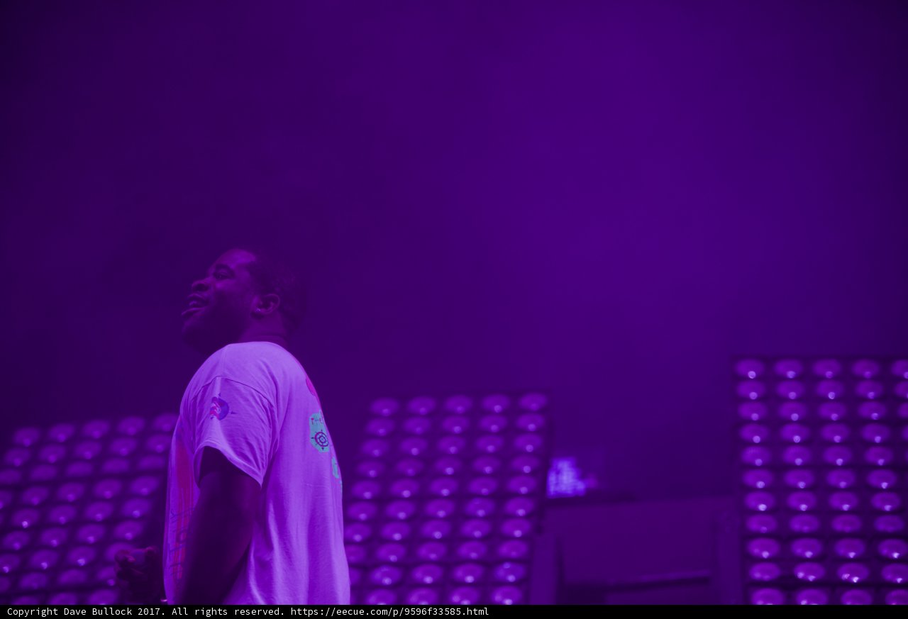 MuMs da Schemer Rocks the Stage in Purple Light
