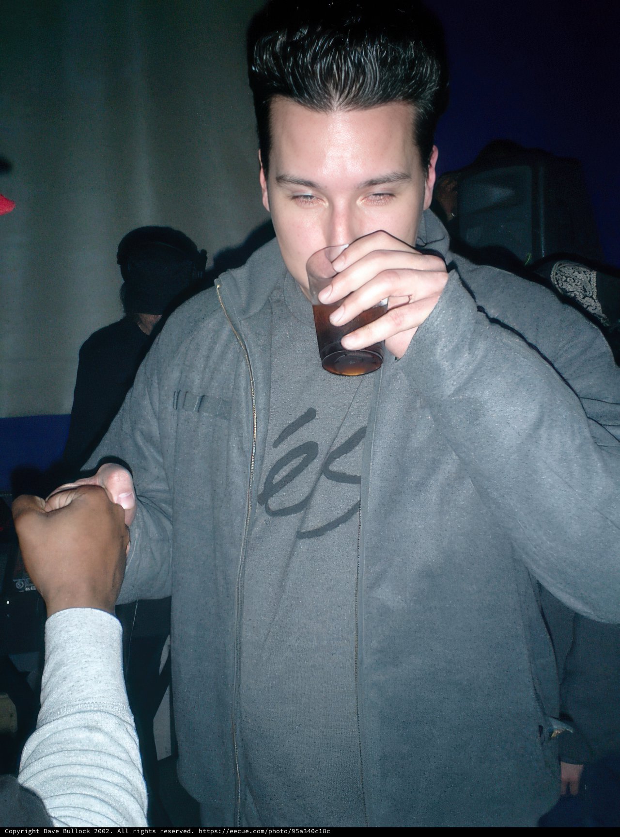 Two Men Enjoying Drinks Together