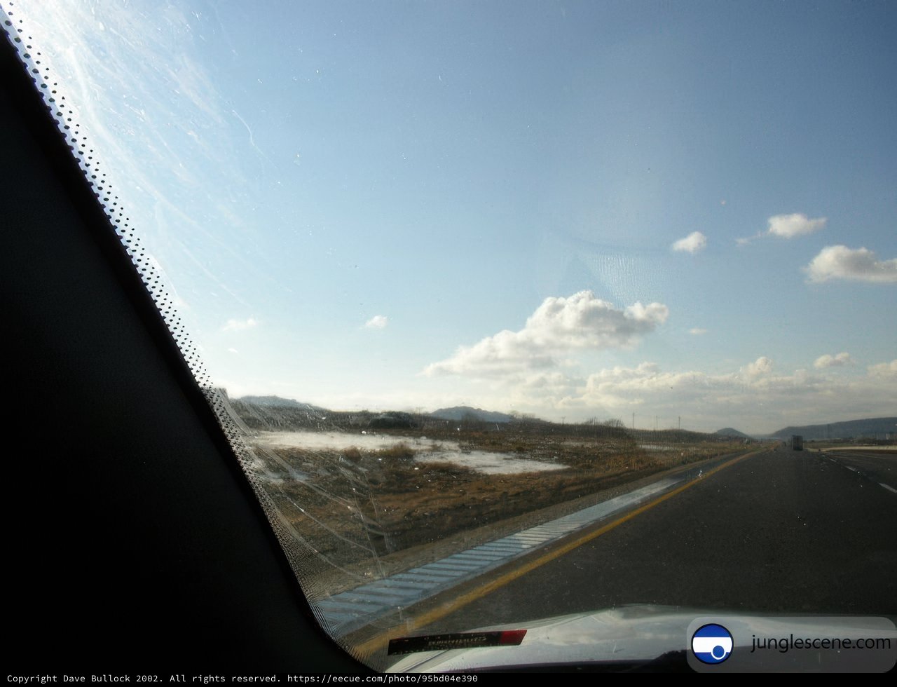 Highway Drive Through Snowy Land
